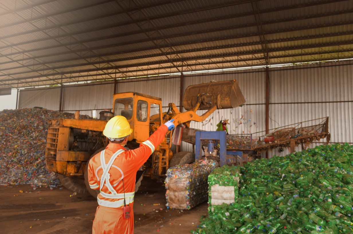 workers in recycling factory,engineers standing in recycling center.Garbage recycle in the factory at Thai Asia.